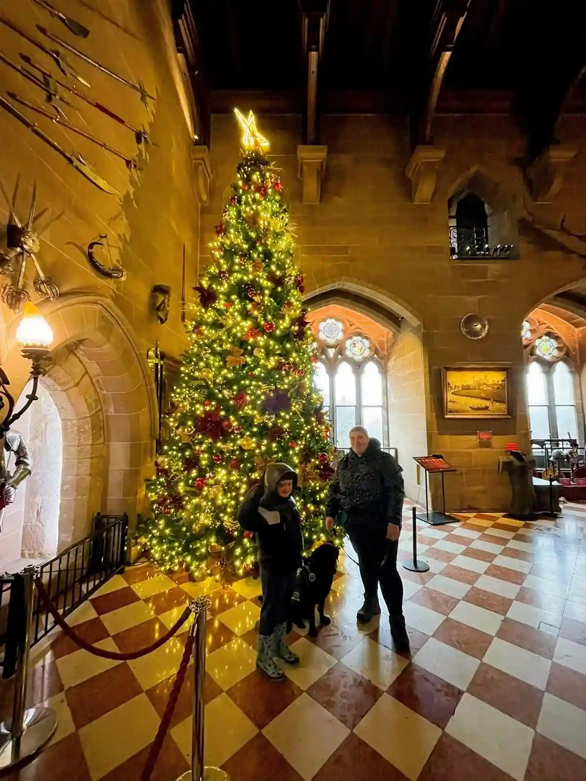 Reco, Jenson And Sarah Stood By Christmas Tree Inside Of Warwick Castle