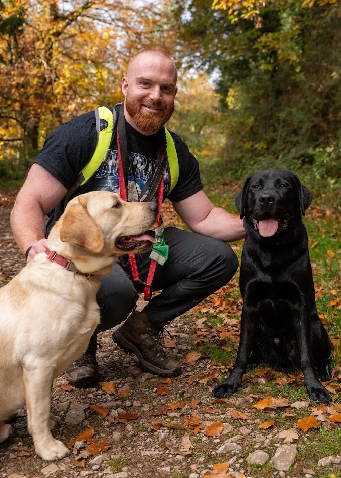 Puppy Socialiser Dan Smiling In Forest While Walking Puppies Frankie And Eddie
