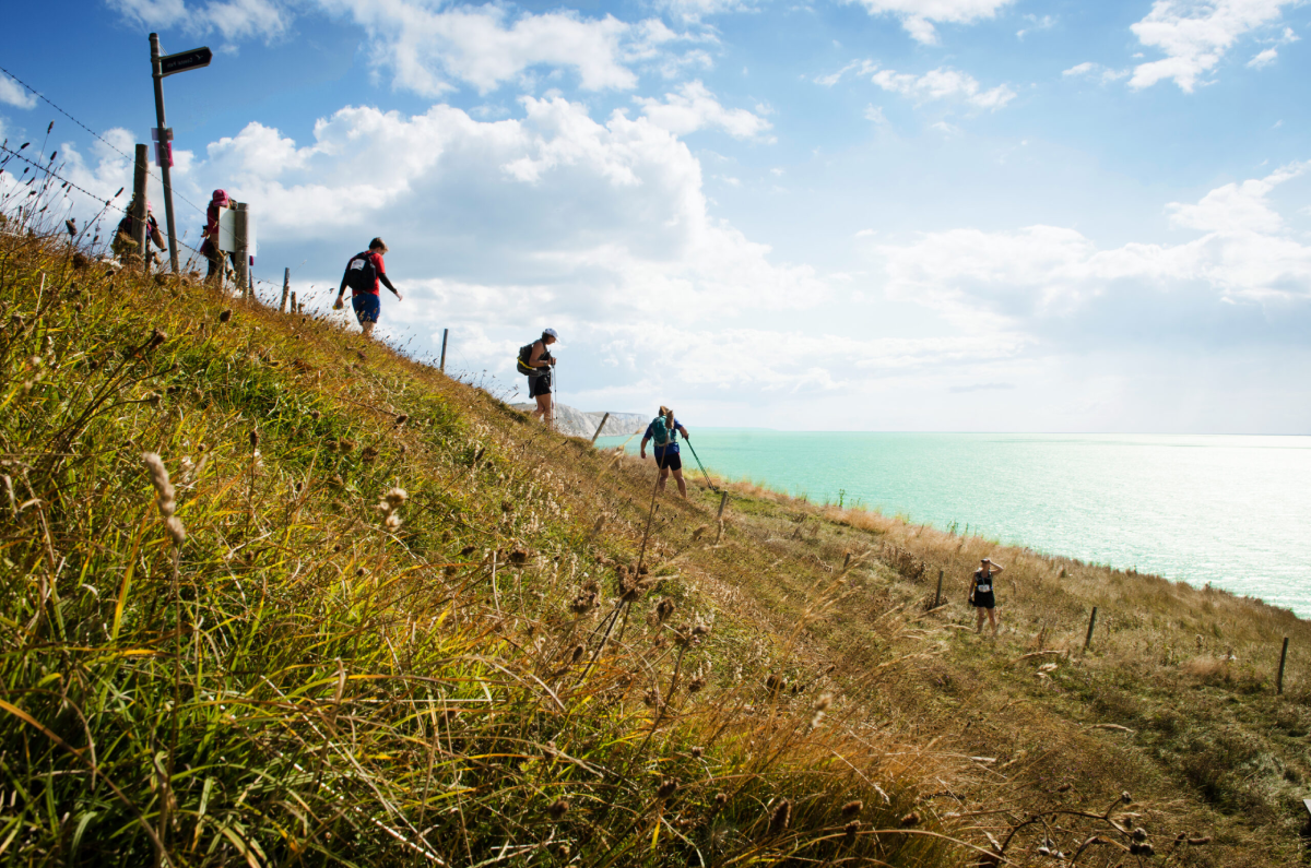 Isle Of Wight Ultra Challenge Participants Trekking Coastal Path Scaled