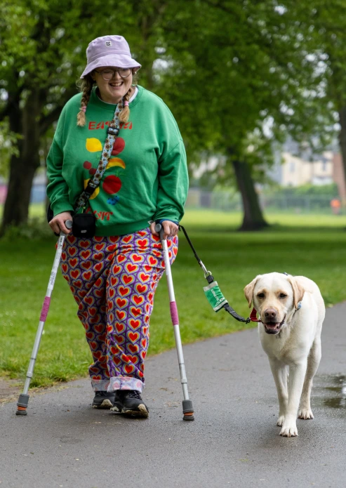 Martha+And+Her+Assistance+Dog+Greg+Walking+Side+By+Side+In+A+Park